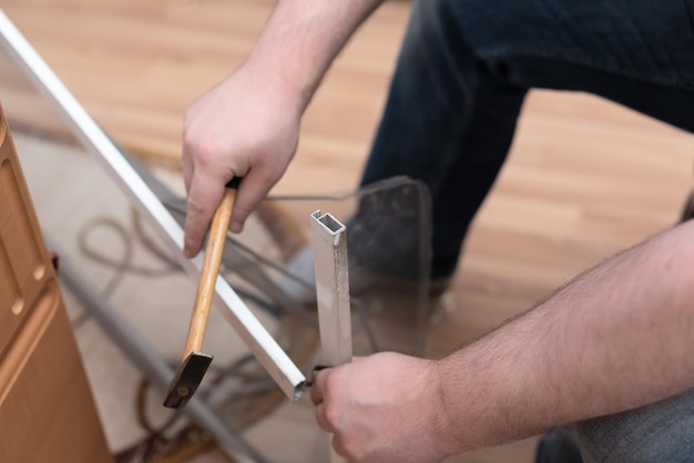 Man repairing mosquito net at home Home improvement concept