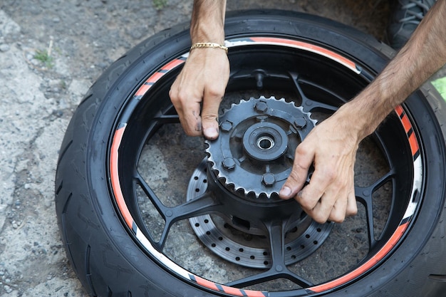 Man repairing motorcycle gear star Maintenance repair motorcycle