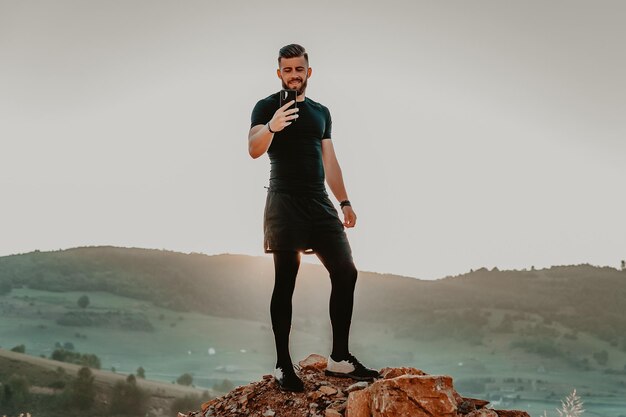 Man rest on top of mountain after training.Motivation concept