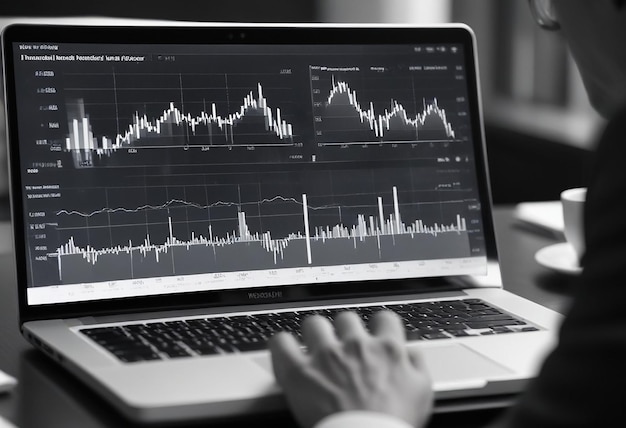 a man reviewnig the Financial report graph Data analyse datum Dashboard On Laptop Business Finance