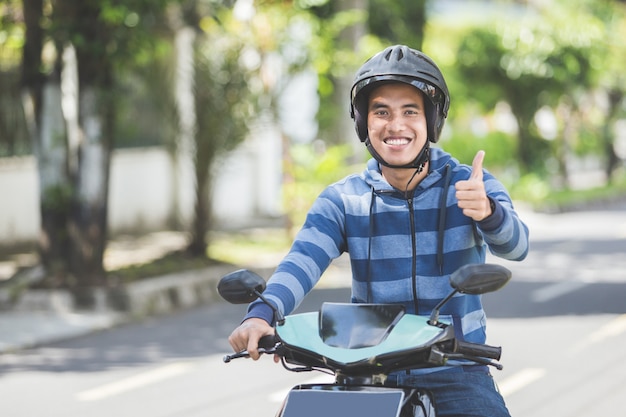 Man riding a motorcyle or motorbike