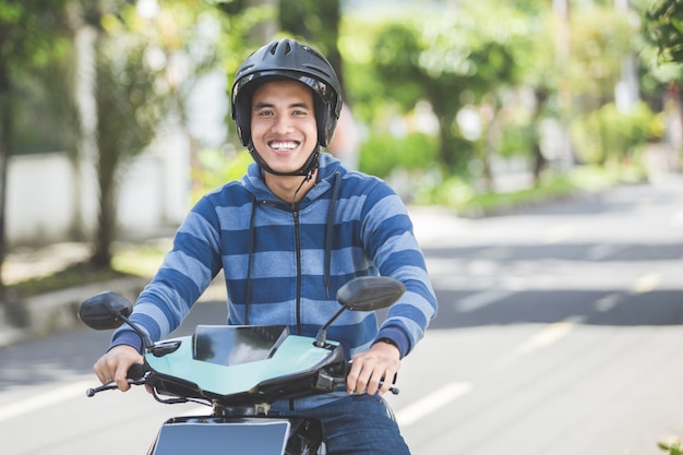 Man riding a motorcyle or motorbike