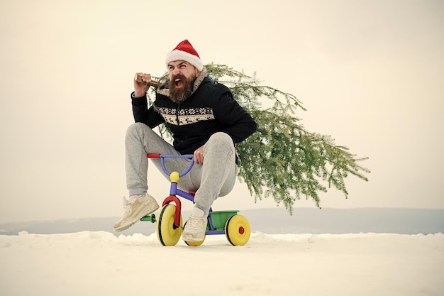 Man riding tricycle on snowy landscape