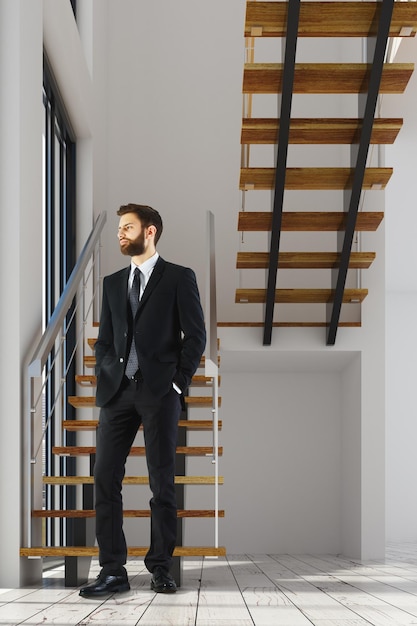 Man in room with stairs