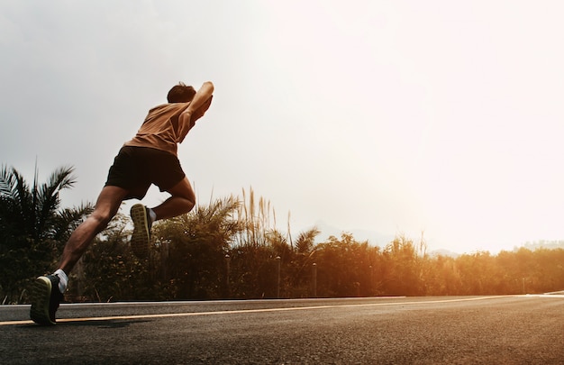 Man runner start running on road