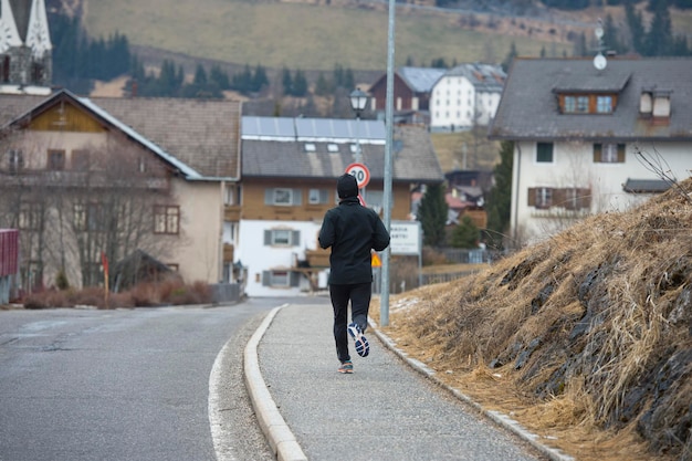 Man running in mountain road