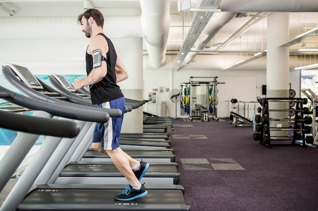 Man running on treadmill at the gym