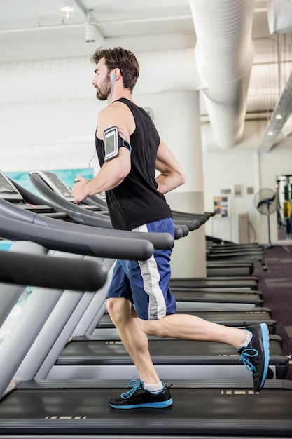 Man running on treadmill at the gym