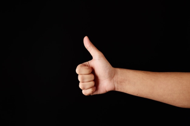 Man's hand showing thumbs up