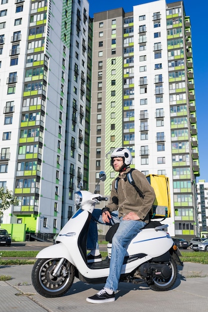 A man on a scooter a food delivery man Fast food delivery company