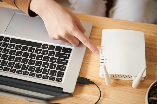 Man Setting up WiFi Router