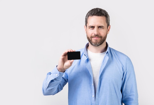 Man show business card isolated on studio background with copy space