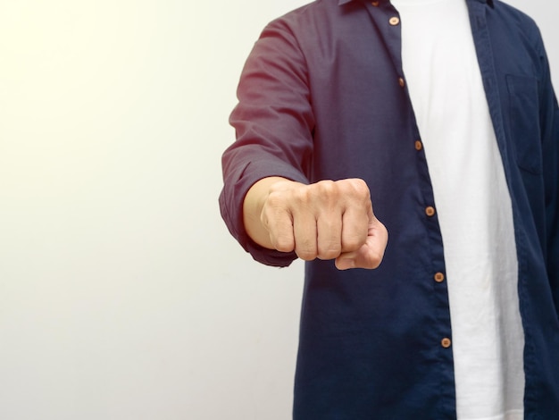 Man show fist impact studio shot isolated