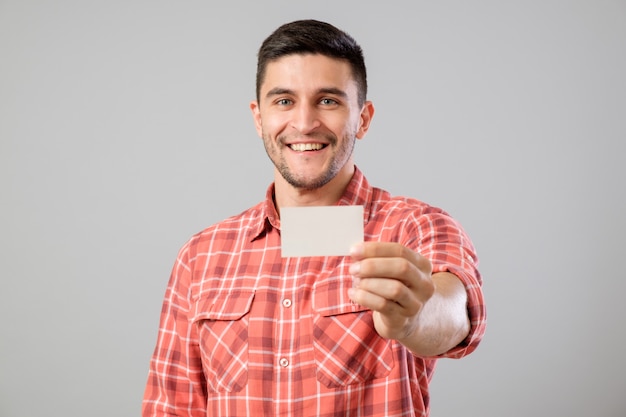 Man showing blank business card