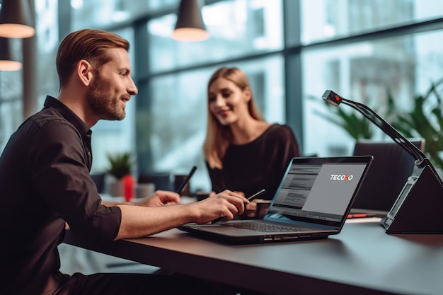 A man sits at a table with a laptop that says'comix'on the screen