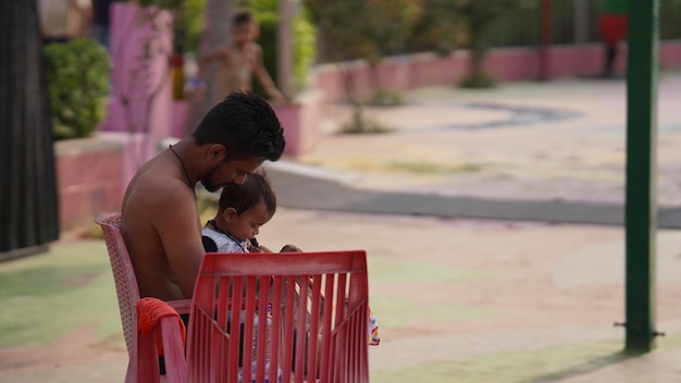 A man sitting alone with his daughter sonipat Haryana India 20 may 2023