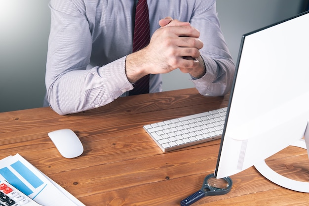 A man sitting at a desk .