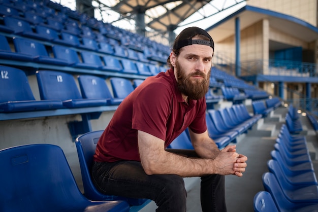 Man sitting on grandstand side view