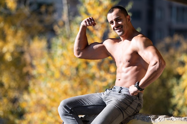 Man Sitting Strong Outdoors in Ruins