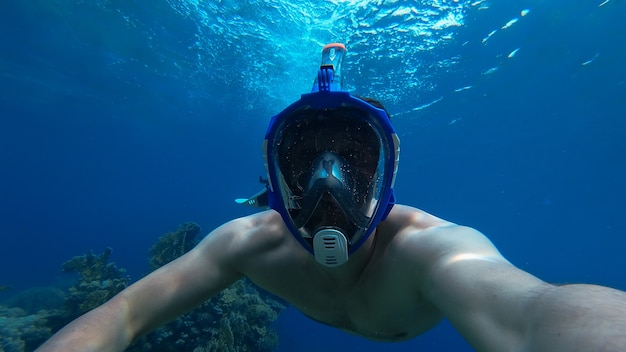 man snorkeling in the sea