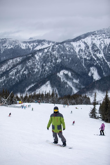 Man snowboarder portrait on ski slope