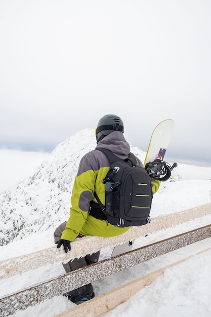 Man snowboarder on the top of the chopok mountain