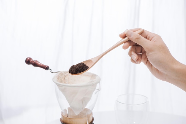 Man spills coffee powder to Drip Coffee