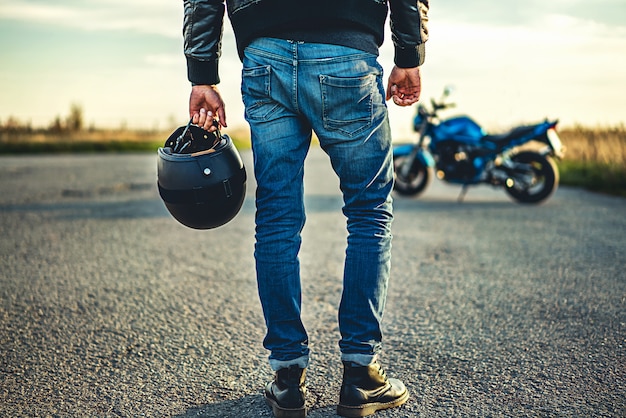 Man on sport motorcycle outdoor on the road