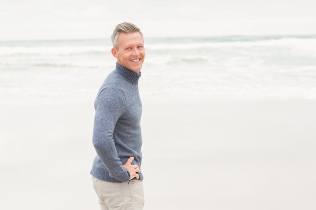 Man standing at the edge of the sea