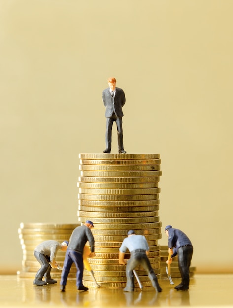 man standing on top of golden coins