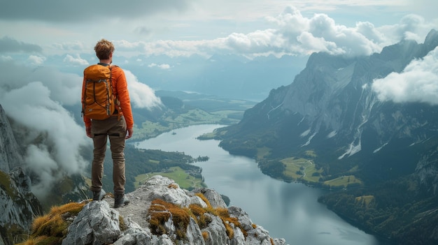 Man Standing on Top of a Mountain With a Backpack