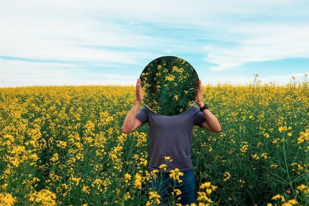 Man standing in yellow flowers