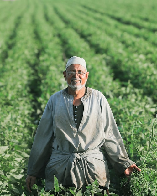 a man stands in a field with a shirt that says  no