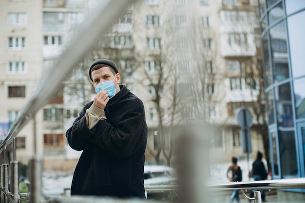 Man in the street wearing protective mask.