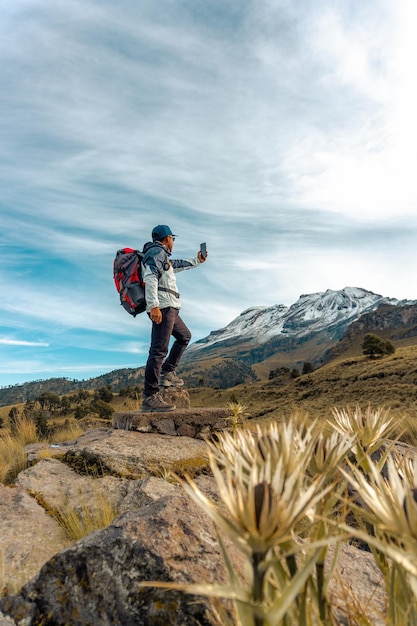 Man success selfie on mountain peak