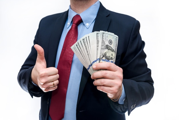 Man in suit holding dollar banknotes isolated  