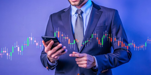 A man in a suit is looking at a phone with a stock market graph on the screen