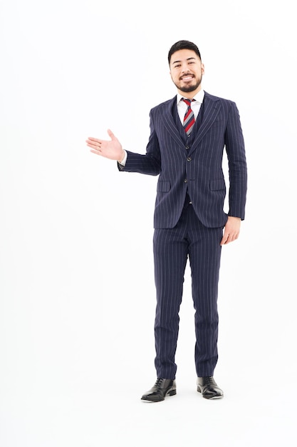 A man in a suit posing for guidance