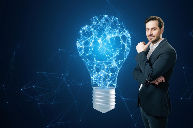 Photo a man in a suit stands confidently next to a digital light bulb idea concept on a blue digital network background