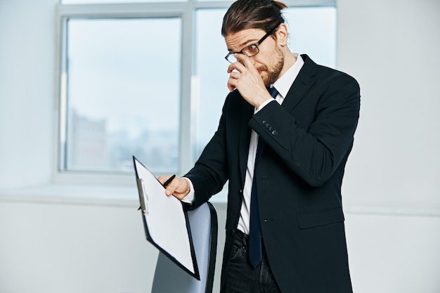 Man in a suit in a suit office work phone technologies