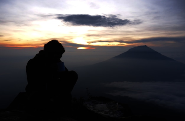 man and the sunrise in mountain        