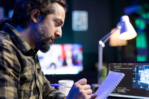 Man taking notes of futuristic software