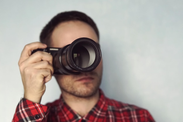 Photo man taking photo of you with mirrorless camera