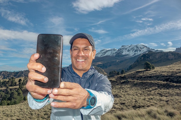 Man taking a selfie in the snowy iztaccihuatl volcano