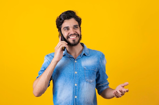 Man talking on cell phone in ear Boy talking on the phone gesturing