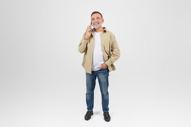 Man talking on phone smiling at camera