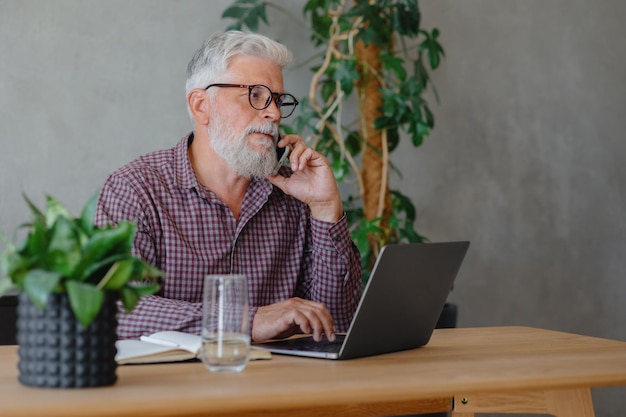 Man talks on the phone with colleagues or business partners solving financial and legal problems