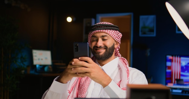 Man texting his friends with cellphone