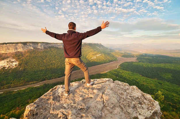 Man on top of mountain