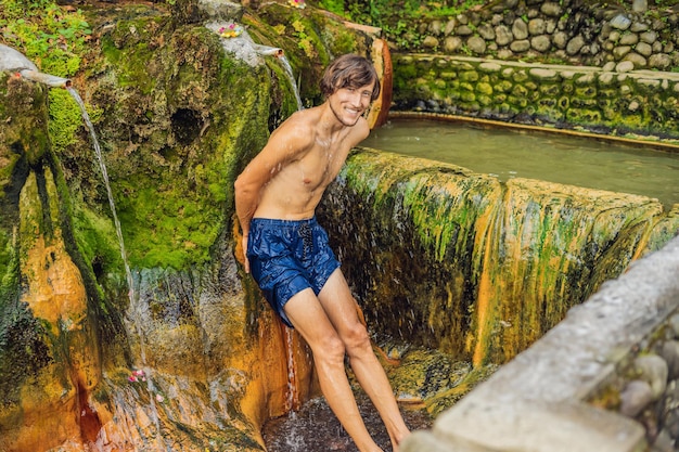 Man tourist in Belulang Hot Springs in Bali, Village Mengesta, Penebel District, Tabanan regency.